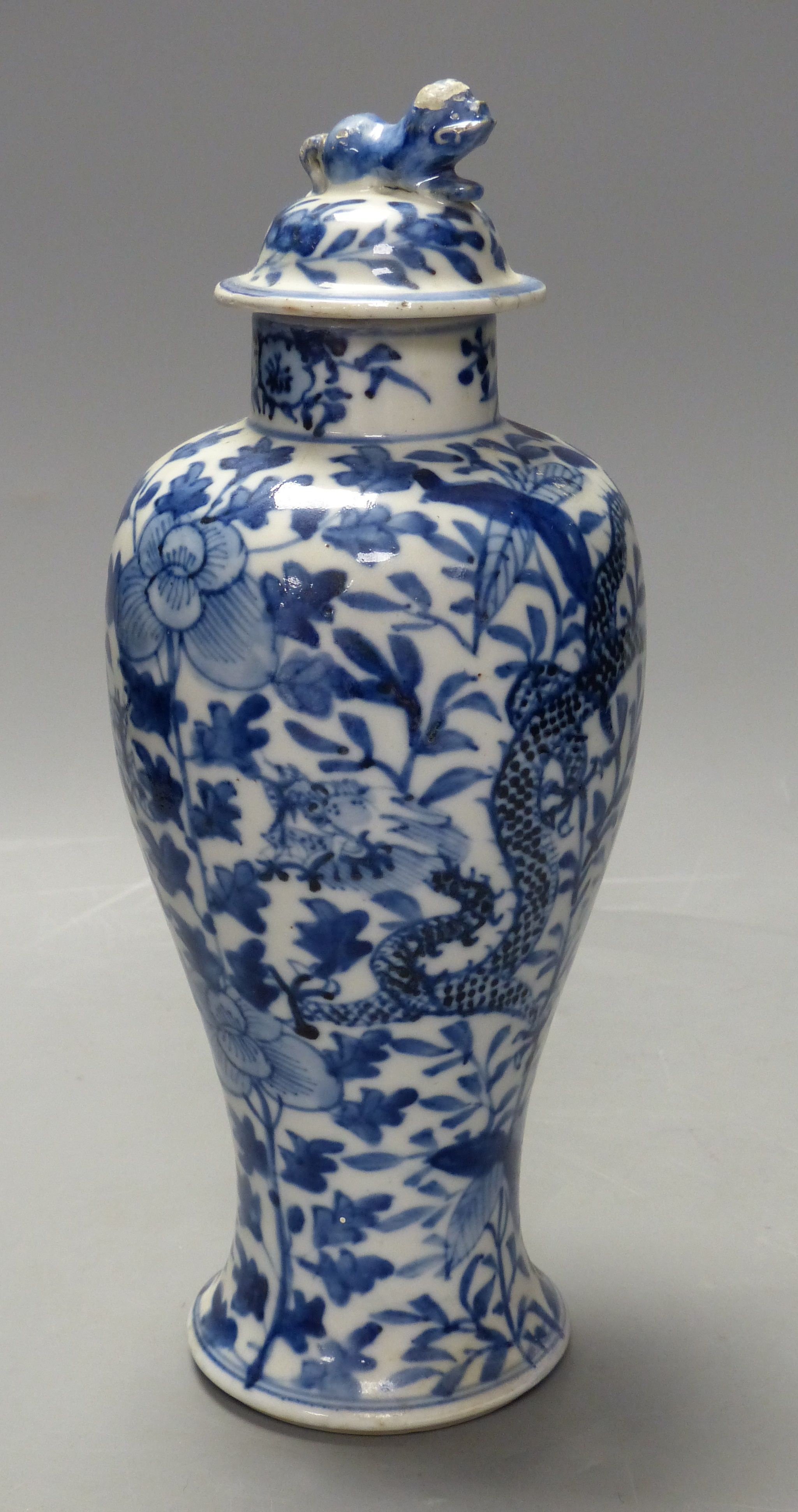 A 19th century Chinese blue and white dragon vase and cover, height 27cm